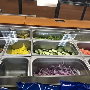 a variety of salads in containers