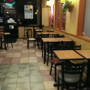 empty tables and chairs in a restaurant