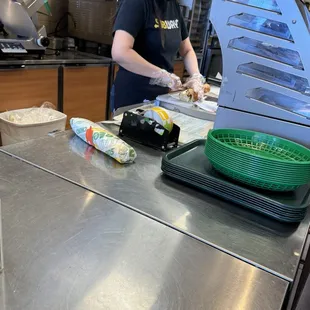 Employee was struggling and sandwich was very messy wrapped.