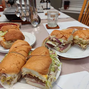 sandwiches on plates on a table