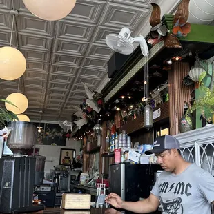 Inside, behind the bar