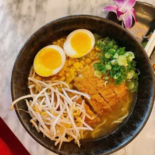 a bowl of ramen with a boiled egg