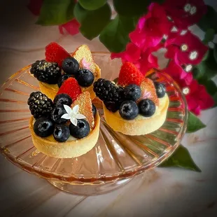 Our gilded fresh fruit tartlets with honey bourbon pastry crème and local flowers.