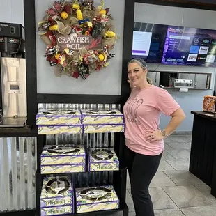 a woman standing in front of the counter