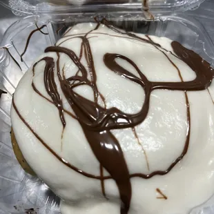 chocolate drizzle on a donut