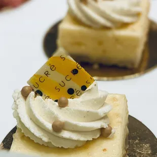 a slice of cheesecake with whipped cream on top