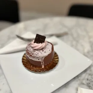 a dessert on a plate with a spoon