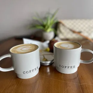two cups of coffee on a table