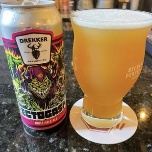 a glass of beer and a can