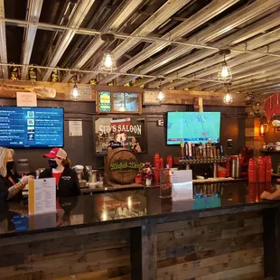 a woman ordering a drink at the bar