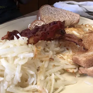 Home fries, bacon, toast and eggs