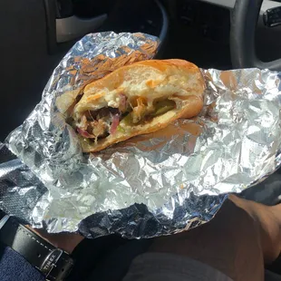 a sandwich wrapped in tin foil