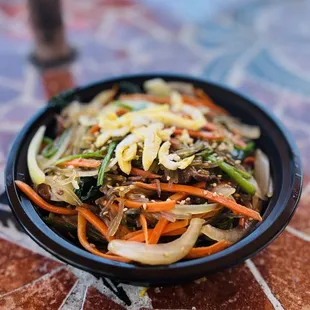 a bowl of stir fried vegetables