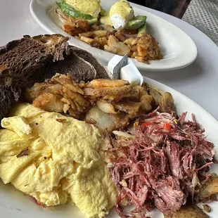 Corn beef hash and egg Benedict with tomato and avocado