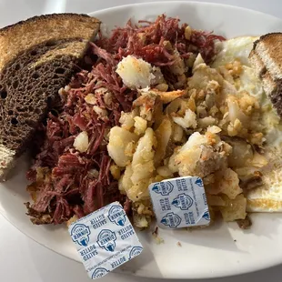 Corn beef hash with two eggs over medium