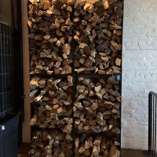 a stack of firewood in a room