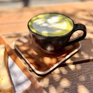 Hot matcha latte with oat milk; the matcha quality is superb. The mug is also beautifully made!