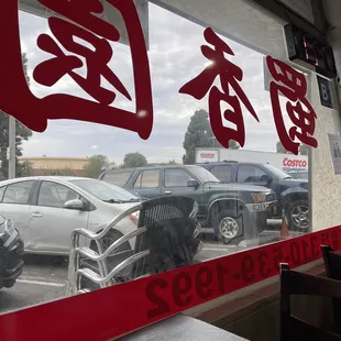 a reflection of a car in the window