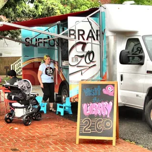  food truck with people standing outside