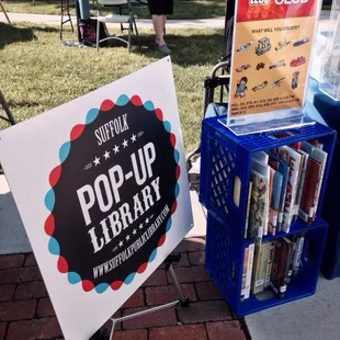 This is so cool! The Pop-Up Library will be here once a month. You can sign up for library cards while you're here too! :)