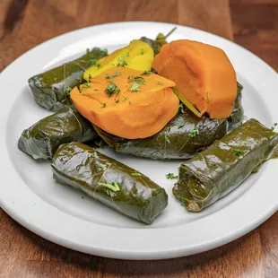a plate of stuffed grape leaves