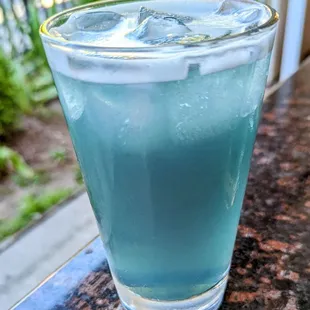 a glass of blue liquid