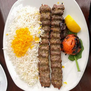 a plate of meat and rice