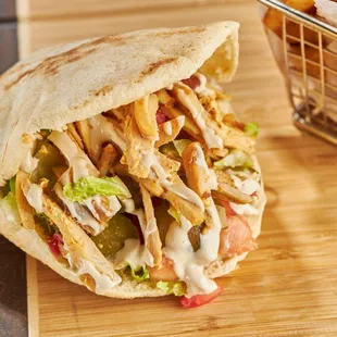 a chicken and lettuce pita