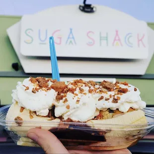 a banana split in a plastic container