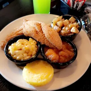 Southern Fried Catfish, Mac and cheese, yams,  smothered potatoes, cornbread and a Sugamama cocktail