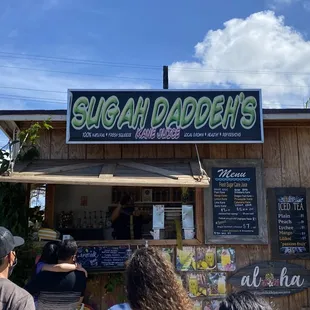 people standing in front of a stand