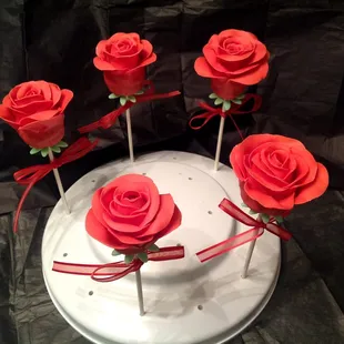 a cake with red roses on top