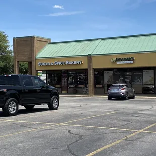 a pickup truck parked in front of a store
