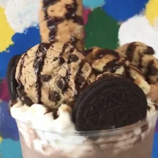 Chocolate crunch/Cookie dough milk shake Oreo and chocolate chip cookies, vanilla wafer crumbs, and a waffle cone straw chocolate syrup