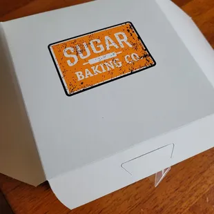 a white box with a sign on it