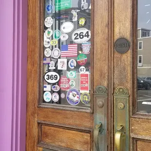 They have a lot of stickers on their door. One is the US flag in all black with a single red and blue stripe.