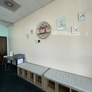 a row of benches in an empty room