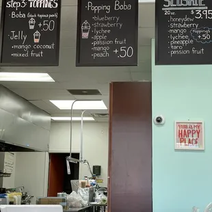 menus on the wall above the counter