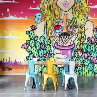 a woman holding a bowl of ice cream