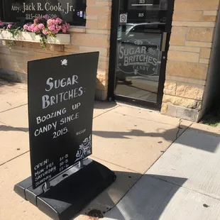 a sign on the sidewalk