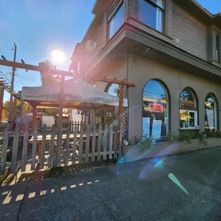 the sun shining through the windows of a restaurant