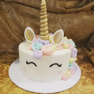 a cake with a unicorn's horn on top