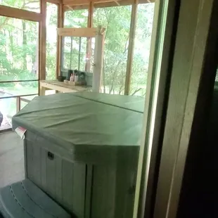 Hot tub on the screened porch