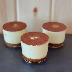 Tiramisu. An Italian style cheesecake made with a coffee soaked cake, mascarpone cheese cream, and cocoa powder.