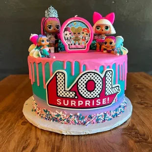 a cake decorated with lol surprise dolls