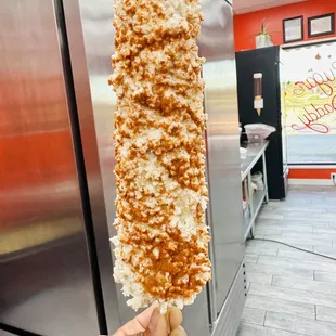 a hand holding a piece of food