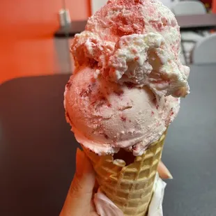 Two scoops in a waffle cone.