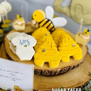 a table with cookies and cupcakes