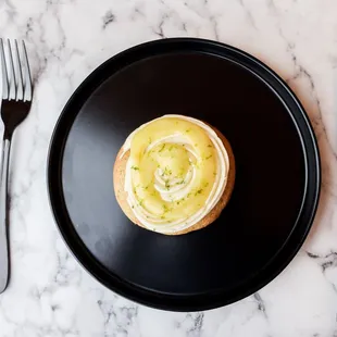 Key lime cookie with vanilla extract buttercream and lime curd topped with lime zest