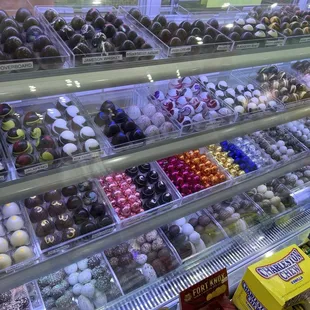 a variety of chocolates in a display case